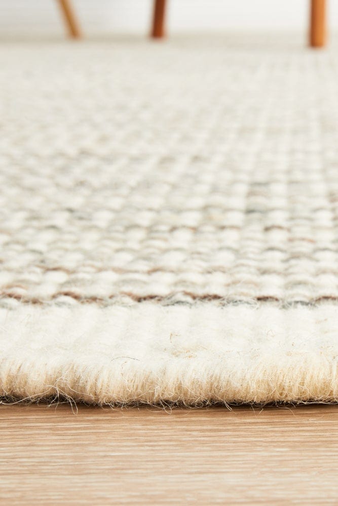 Navia Natural flatweave rug — detail shot of natural wool weave