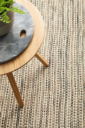 Navia Natural rug — styled in a coastal bedroom setting