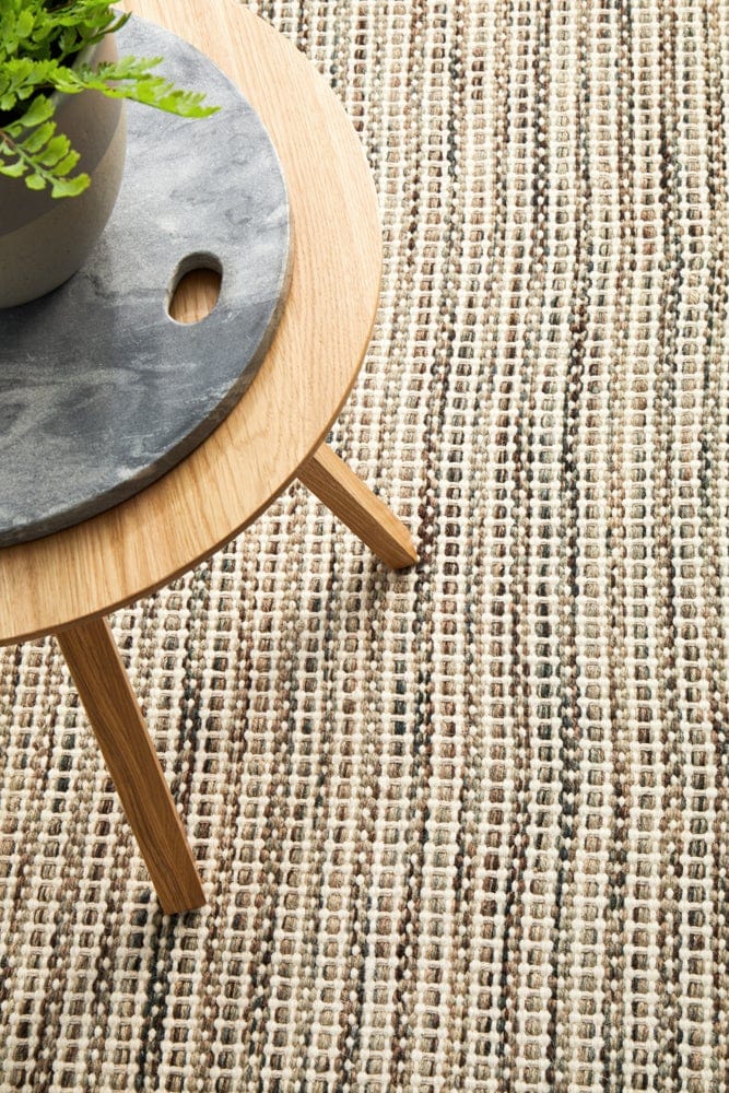 Navia Natural rug — styled in a coastal bedroom setting