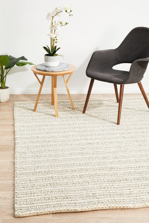 Navia 320 Grey felted wool rug — lifestyle shot in Scandi living room