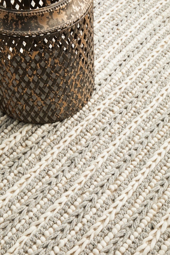 Navia 320 Grey rug — styled in an open-plan living room with neutral palette
