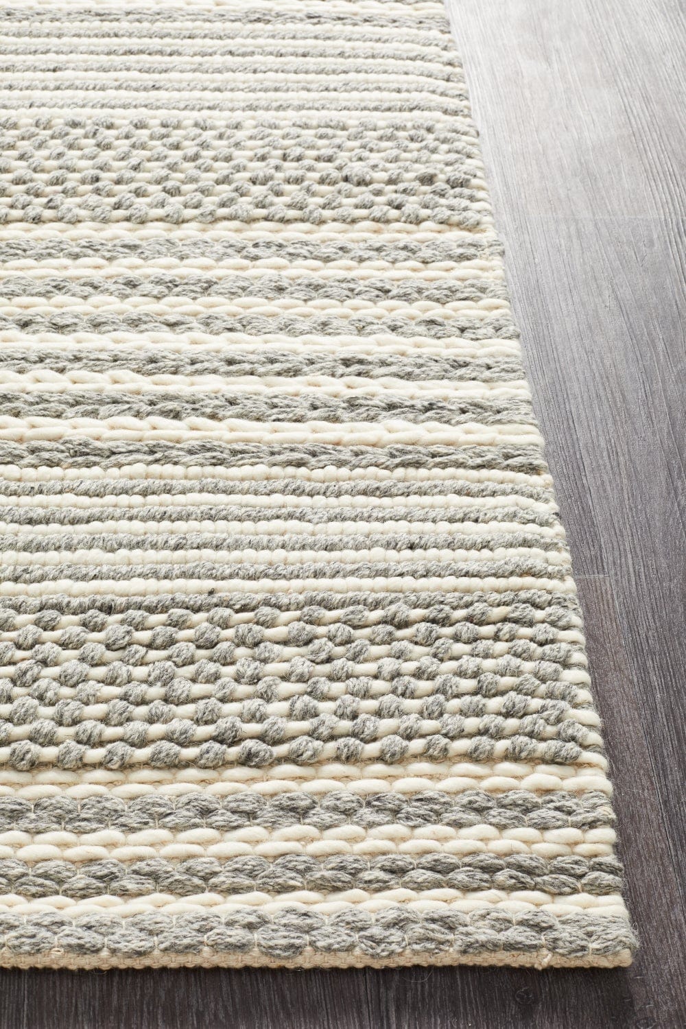 Navia 340 Silver rug styled in a contemporary minimalist bedroom
