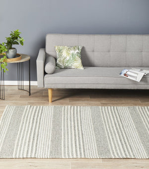 Navia 340 Silver felted wool rug — lifestyle shot in Scandi living room