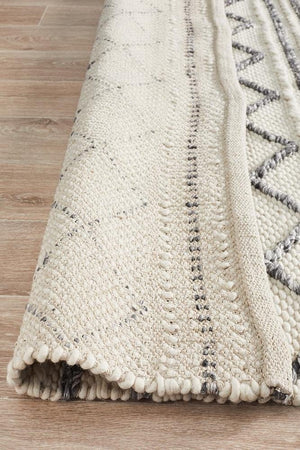 Leka Textured woollen rug — detail shot of white and grey hand-woven wool weave
