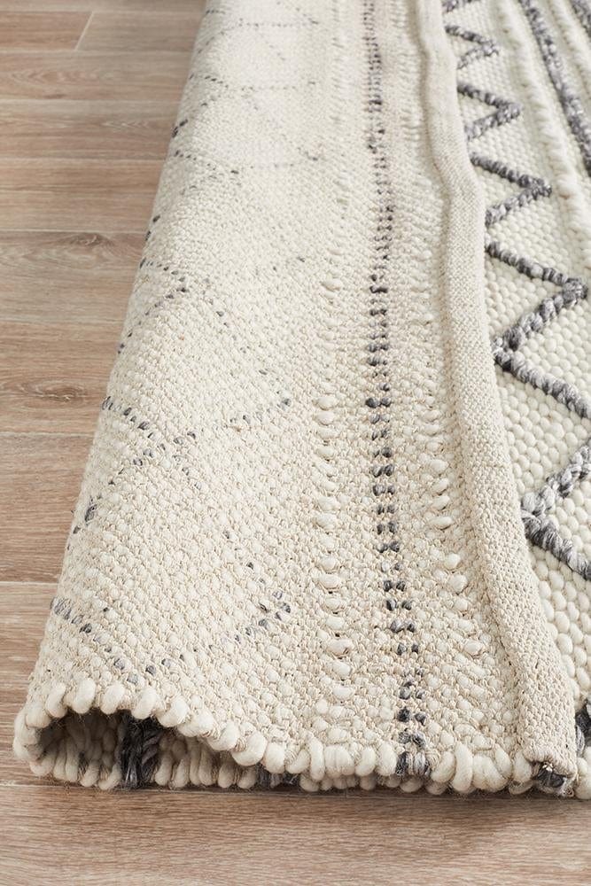 Leka Textured woollen rug — detail shot of white and grey hand-woven wool weave